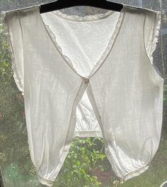 This antique cotton corset cover camisole is from the early 1900s.  Hand-spun dainty lace trim. Fastens at the front with buttons. A collector's item Size XXXS Corset Cover, Cotton Corset, Womens Blouses, October Wedding, Early 1900s, Antique White, Hand Spinning, Wedding Outfit, Womens Clothing Tops