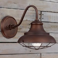 an outdoor wall light on a wooden wall