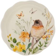 a plate with a bird and flowers painted on it