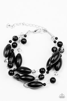 a bracelet with black beads and silver chains