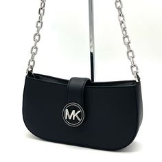 Brand New With Tag Michael Kors Carmen Small Pouchette Crossbody Bag Color: Black Material: Saffiano Silver-Tone Hardware Chain Handle Flap With Magnetic Snap Button Closure Interior Features: 1 Wall Pocket 9.25”W X 4.5”H X 2.75”D Chic Bags With Silver-tone Logo Plaque For Everyday Use, Black Bag With Silver-tone Logo For Everyday Use, Shoulder Bag With Silver-tone Logo Plaque For Everyday Use, Classic Black Shoulder Bag With Silver-tone Logo, Silver Bag With Metal Logo For Everyday Use, Silver Evening Bag With Metal Logo, Michael Kors Silver Shoulder Bag With Branded Hardware, Classic Shoulder Bag With Silver-tone Logo Plaque, Chic Black Bag With Silver-tone Logo Plaque