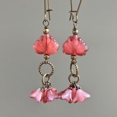 "Raspberry Flower Earrings - Small Raspberry Pink Czech Glass Flowers dangle from Czech Maple Leaf with antiqued brass beads. Antiqued Brass Earwires and Findings Earrings measure slightly over 2.5\" from top of earwire to bottom." Handmade Czech Glass Vintage Flower Earrings, Handmade Vintage Czech Glass Flower Earrings, Handmade Czech Glass Flower Earrings In Vintage Style, Vintage Adjustable Dangle Flower Earrings, Handmade Vintage Dangle Flower Earrings, Vintage Pink Metal Earrings, Handmade Czech Glass Vintage Earrings, Handmade Vintage Czech Glass Earrings, Vintage Pink Nickel-free Earrings