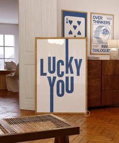 there is a sign that says lucky you next to a wooden table in the room