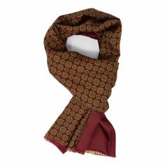 Add a level of sophistication to your wardrobe with this wool and silk scarf. Detailed with a gold medallion print on one side and a lush burgundy shade on the reverse, this scarf instantly adds richness to one's outfit. With both wool and silk fabrics, this scarf is bound to keep its wearer both warm and fashionable. Wear with a navy suspenders for the full-effect. With every purchase, you will receive our "How to Style Your Scarf" . #scarf #silkscarf #madeinitaly #serafinesilk #printedscarf Medallion Print, Silk Fabrics, Gold Medallion, Modern Gentleman