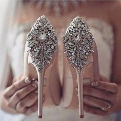 the brides shoes are adorned with jewels