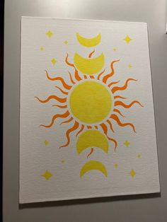 the sun and moon are painted on white paper