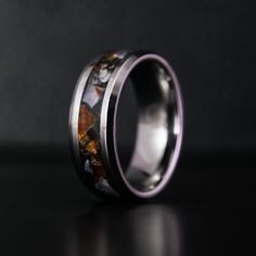 Patrick Adair Designs' Birthstone Series features our one-of-a-kind glowstone rings with each month's birthstone featured in the inlay of a durable tungsten band. Each birthstone ring comes with glow in the dark features. ■ How It's Made: https://www.youtube.com/watch?v=-7aBWg2Mq34 ■ Ring Details: - Metal Type: Tungsten-Carbide - Width: 6mm, 8mm - Profile: Beveled - Inlay Materials: sardonyx fragments - Band: Comfort Fit ■ Resizing: If your ring doesn't fit perfectly, we will be more than happy Tungsten Carbide Promise Ring, Round Tungsten Carbide Promise Ring Jewelry, Polished Titanium Ring Jewelry, Round Tungsten Carbide Jewelry Gift, Polished Titanium Ring, Silver Tungsten Carbide Ring As Gift, Dark Features, Birthstones By Month, August Birthstone Ring