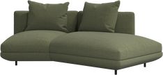 a large green couch with pillows on it's back and side ends, in front of a white background