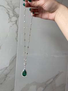 Elegant Silver Drop Emerald Necklace, Emerald Diamond Necklace With Brilliant Cut Pear-shaped, Pear-shaped Emerald Necklace With Brilliant Cut Diamonds, Pear-shaped Brilliant Cut Emerald Diamond Necklace, Elegant Green Pear-shaped Diamond Necklace, Elegant White Gold Teardrop Emerald Necklace, Elegant Emerald Clavicle Chain Necklace For Formal Events, Elegant Teardrop Emerald And Diamond Necklace, Elegant Emerald Teardrop Pendant Necklace For Weddings