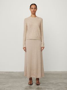 The Mira sweater is knitted in textured cashmere silk (77% cashmere, 23% silk), that offers a light and lofty hand-feel that's created as a go-to for the Spring Summer months. The regular fit is framed by a neat crew neck, full-length sleeves, and ribbed trims. Paired here with the Elin skirt. Elegant Cashmere Knit Sweater, Chic Cashmere Textured Knit Sweater, Chic Cashmere Sweater With Textured Knit, Chic Textured Cashmere Sweater, Chic Textured Knit Cashmere Sweater, Spring Cashmere Sweater With Knit Fabrication, Spring Cashmere Knit Sweater, Elegant Knit Sweater With Soft Texture, Long Sleeve Cashmere Sweater With Soft Texture