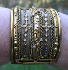 "Wonderfull AMAZING Chunky gold tone stones Bracelet unsigned. 1970's Measures inside 2 1/4 x 2 5/8\" x 2 2/8\" wide. missing a few tiny pearls other wise it's in very good vintage condition" Gold Victorian Cuff Bracelet With Intricate Design, Antique Gold Cuff Bracelet With 17 Jewels, Unique Gold Beaded Cuff Bracelet, Unique Gold Cuff Bracelet With Intricate Design, Vintage Jeweled Bangle Cuff Bracelet, Vintage Jeweled Gold Bracelets, Antique Jeweled Gold Bracelets, Vintage Gold Jeweled Bracelets, Antique Gold Cuff Bracelet Collectible