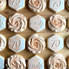 there are many decorated cookies with frosting on the top and one has a rose