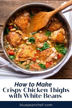 chicken thighs with white beans and spinach in a skillet on top of a wooden table