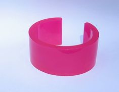 Height 3.5 cm- 3.2 cm opening. 6.3 cm approx inner diameter (at largest point) Fits most wrists.Glows pink. Trendy Luminous Jewelry For Gifts, Unique Adjustable Pink Cuff Bracelet, Pink Party Cuff Bangle Bracelet, Pink Party Cuff Bracelet Bangle, Handmade Pink Cuff Bracelet For Gift, Pink Plastic Rave Bracelets, Pink Plastic Bangle Jewelry, Trendy Handmade Cuff Bracelet For Party, Hot Pink Bracelets