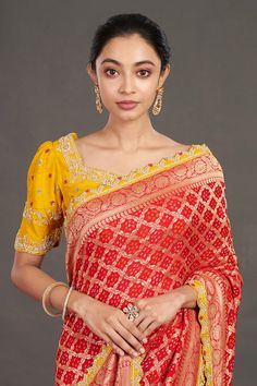 Red saree with geometric, floral woven motifs. Paired with yellow resham, sequin embroidered blouse.
Component: 2
Pattern: Woven, Embroidery
Type Of Work: Geometric, floral, resham, sequin
Neckline: V neck
Sleeve Type: Half
Fabric: Silk
Color: Red,Yellow
Other Details: 
Scallop border
Back cut-out detailing
Occasion: Wedding - Aza Fashions Woven Embroidery, Bandhej Saree, Scallop Border, Yellow Saree, Fashion Journals, Red Saree, Blouse For Women, Yellow Blouse, Fabric Silk