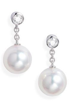 Bezel-set diamonds anchor these cultured pearl drop earrings that swing and sway from dainty 18-karat gold chains. Total diamond weight: 0.16ct. Color: F–G Clarity: VS1 Pearl size: 8–8.5mm Cultured pearl/18k gold/diamond Made in Japan >Diamond Guide Asian Owned/Founded Mikimoto Pearl Earrings, Mikimoto Earrings, Mikimoto Pearls, Pearl And Diamond Earrings, Diamond Guide, Bezel Set Diamond, Diamond Drops, Pearl Diamond, Gold Drop Earrings