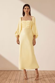 Luxe Ruched Bodice Long Sleeve Midi Dress | Lemon | Dresses | Shona Joy Light Yellow Dress Formal, Light Yellow Dress Outfit, Wedding Guest Outfit Long Sleeve, Coctail Dresses 2024, Elegant Midi Dress Wedding, Yellow Dress Long Sleeve, Yellow Knee Length Dress, Lemon Fashion, Light Yellow Dress