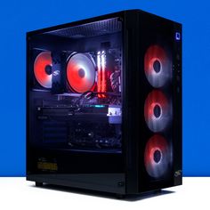 a computer case with red and black speakers on the side, against a blue background