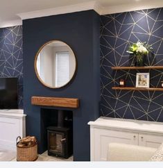 a living room with blue walls, white furniture and a large mirror on the wall