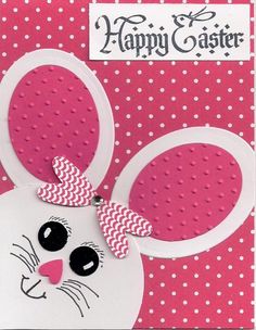 a pink and white card with a bunny's head