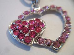 Pink double heart necklace. It measures approx. 19 inches and has a toggle clasp closure. Made with a light pink rhinestone heart silhouette and a smaller solid hot pink rhinestone heart. Silver tone. Perfect for give or wear on Valentine's Day. All sales are final and as is. Thank you for looking. You may also love this: https://www.etsy.com/listing/584789387/heart-silhouette-pendant-necklace?ref=shop_home_active_1 Pink Metal Jewelry With Bling, Pink Bling Metal Jewelry, Pink Open Heart Jewelry For Valentine's Day, Heart Shaped Valentine's Day Bling Jewelry, Valentine's Day Heart Shaped Bling Jewelry, Valentine's Day Heart-shaped Bling Jewelry, Pink Metal Heart Necklace For Valentine's Day, Pink Heart Pendant Metal Jewelry, Pink Heart Pendant Jewelry