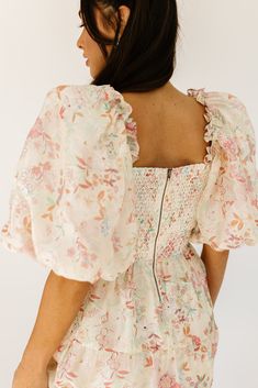 this vintage-inspired puff sleeve midi dress is a zoco hunny essential. featuring a soft spring floral pattern with a slimming smocked bodice + dreamy puff sleeves, it’s the perfect formal dress for brunch dates, garden parties, + bridal showers. pink + sage floral // midi length, square neck, smocked, puff sleeve, pockets, back zipper, fully lined, organza model is 5'8" + wearing a small measurements are approximate + taken while laying flat small : bust 34” (smocked) length 48” medium : bust 3 Dress For Brunch, Brunch Dates, Soft Spring, Puff Sleeve Midi Dress, Puff Sleeve Dress, Garden Parties, Dress Spring, Puffed Sleeves Dress, Sleeve Midi Dress