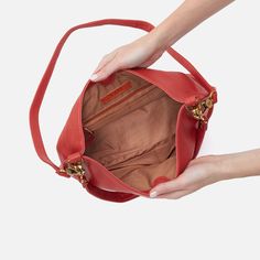 This bag pairs style and function effortlessly, converting from a shoulder bag to crossbody for two looks in one. Pier Shoulder Bag In Pebbled Leather  Red Clay SHOULDER in Red Clay | Hobo® Leather Hobo Bag With Detachable Strap For Everyday, Red Top Handle Bucket Bag With Gold-tone Hardware, Red Bucket Bag With Detachable Strap And Double Handle, Leather Lined Satchel Hobo Bag, Daily Leather-lined Satchel Hobo Bag, Versatile Red Satchel For Everyday Use, Versatile Everyday Red Satchel, Everyday Leather-lined Hobo Shoulder Bag, Everyday Hobo Shoulder Bag With Leather Lining