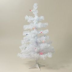 a white christmas tree with red and blue lights