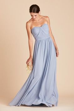 a woman in a strapless blue dress