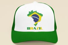 Celebrate your love for Brazil with this eye-catching Brazil flag map hat! Featuring iconic elements inspired by Rio de Janeiro, Sao Paulo, and Brasilia, this Brazil trucker hat is the perfect accessory for any airport outfit or casual day out. Show off your passion for Brazilian culture, from Brazilian hairstyles to Brazilian recipes, and root for your favorite soccer players in style. This versatile Brazil cap makes an excellent Brazil travel gift idea for anyone who adores South America destinations. Get your Brazilian pride on today! Travel Gift Ideas, Brazil Travel, Maputo