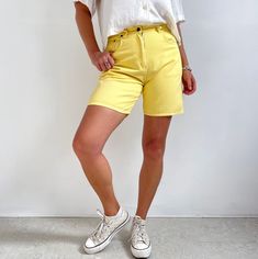 Classic 90's vintage ladies denim shorts in wonderful sunny, lemon yellow. They are of mid-thigh length with a high waist, belt loops, pockets, rivets and a zip and button fly. The denim is sturdy, without any stretch. Stylish, classy denim shorts that can take you from the beach and into the city. Made by Originals. 100% cotton. Small size, labelled as 14. Would suit UK 8-10. Measurements when laid flat are: Waistband: 38cm / Waist size 30 inches. Hips: 56cm  Inseam: 17cm Outer seam: 47cm Excel Ladies Denim Shorts, Jean Bermuda Shorts, Yellow Denim, Ladies Denim, Midi Shorts, Denim Shorts Women, Short En Jean, Lemon Yellow, Skorts