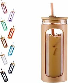 an image of a drink in a glass with straws on the top and different colors around it