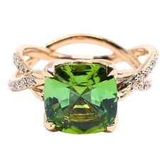 Thomas Leyser is renowned for his contemporary jewellery designs utilizing fine gemstones. This 18k red gold ring (5.04g) is set with 1 fine Tourmaline in magnificient greenish colour and large facettes (cushion cut, 9x9mm, 2.94 carat) and Diamonds. Tourmalines are renowned for their high light reflecting properties which create a mesmerising effect and ensures that the ring looks spectacular from any angle. The ringsize is 6 3/4 (53.5). Luxury Gold Tourmaline Jewelry, Luxury Gold Tourmaline Rings, Luxury Tourmaline Rectangular Rings, Fine Jewelry Green Tourmaline Gemstones, Luxury Green Tourmaline Jewelry, Green Tourmaline Ring, Contemporary Jewelry Design, Birthday Ring, Tourmaline Ring