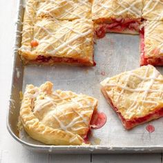 several pieces of pie sitting on top of a pan