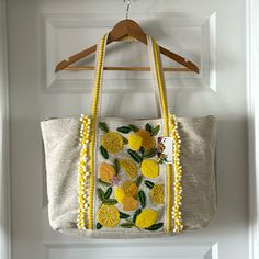 Darling Lemon Embossed Tote Bag. Nwt. Durable Canvas With A Yellow Cotton Lining. Can Be Fully Opened Or Made Smaller With Inside Hook Closure. Inside Zipper Pocket And 2 Additional Slip Pockets. Perfect Beach Tote Or Off To The Farmers Market. Or Everyday Use. Add Accessories Inside And Give As A Gift Excellent Condition. Never Used. Yellow Quilts, Quilted Tote Bags, Quilted Totes, Beach Tote, Farmers Market, Canvas Bag, Emboss, Zipper Pocket, Tote Bags