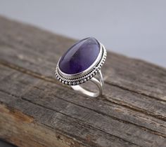 Description Amethyst Ring, Large Silver Ring, Bohemian Jewelry, Birthstone Jewelry, Rings for Women, Birthstone Ring, Oval Stone Ring, Gift Jewelry✦Gemstone: Natural Amethyst✦Stone Shape : Irregular shape Cabochon✦Stone Size: Approximately 13-19 mm✦Metal: 925 Sterling Silver Natural stones may vary slightly in shape, size and color.Handmade ItemYou will receive the same piece as in the picture or identical. Since all gemstones are different from each other, I cannot guarantee that the gemstone you see above will still be available.. But I assure you will get same quality piece as shown in the above picture.# Your order will be dispatch within 3-5 working days after receiving order# Items will be sent via registered airmail and take approx. 15-20 days to arrive. # Express mail Via FedEx/DHL Silver Ring With Stones For Women, Silver Stone Rings Women, Silver Rings For Women Stones, Jewlery Rings, Silver Jewlery, Silver Rings With Stones, Cabochon Ring, Coin Jewelry, Amethyst Stone