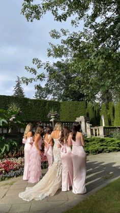 the bridesmaids are getting ready to walk down the aisle