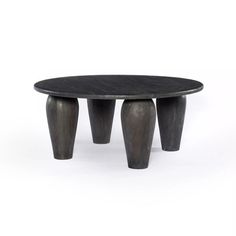 a black table with three legs on it