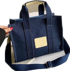 Denim Blue Rectangular Shoulder Bag With Large Capacity, Large Capacity Denim Blue Rectangular Shoulder Bag, Trendy Blue Canvas Satchel, Denim Blue Large Capacity Shoulder Canvas Bag, Denim Blue Large Capacity Canvas Shoulder Bag, Trendy Blue Canvas Bag With Pockets, Daily Blue Denim Canvas Bag, Daily Use Blue Denim Canvas Bag, Trendy Blue Denim Shoulder Bag