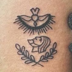 a tattoo on the side of a woman's stomach with an image of a bird and a dove