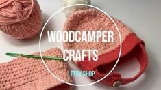 two crocheted hats with yarn on them and the words woodcammer crafts