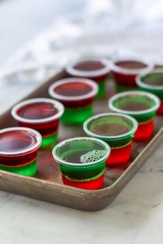 a tray filled with red and green cups