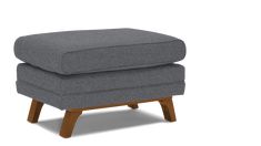 a grey ottoman with wooden legs on a white background