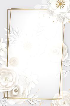 an elegant white and gold wedding card with paper flowers on the side, in front of a