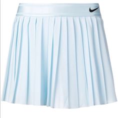 a women's tennis skirt with pleaing on the bottom and black nike logo