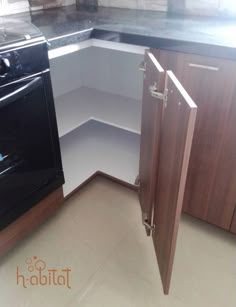 a kitchen with an oven, dishwasher and cupboards in the corner on the floor