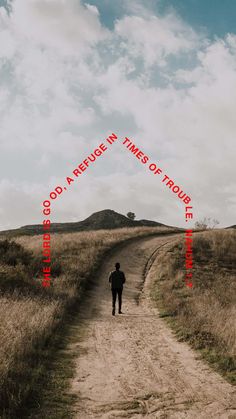 a person walking down a dirt road with the words god's refuge in times of trouble