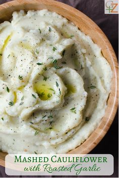 mashed cauliflower with roasted garlic in a wooden bowl