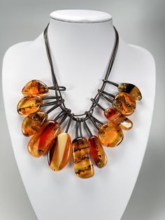 Seller ref-(S118) Sobral - Amber "Alta" Resin Necklace ( 005309 ) Brand - sobral  Material - resin  Type- necklace multi coloured amber  Style - stand out colourful necklace  New with original tags  Includes video Size - included in photo  Includes white and black dust bag .   All our products are official sobral  We post daily via Royal Mail tracked 24 , we well pad and take great care when packaging our items for posting .  Sobral - Amber "Alta" Resin Necklace ( 005309 )All Sobral pieces are d Handmade Orange Resin Necklace, Unique Amber Resin Necklaces, Luxury Hand-strung Amber Beaded Necklaces, Handmade Amber Multi-strand Necklace, Unique Hand-strung Orange Necklace, Resin Necklace, Colourful Necklace, Wedding Jewellery Necklace, Jewelry Diy