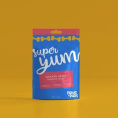 a bag of yummy chicken meat sits on a yellow surface with the words super yum in white lettering